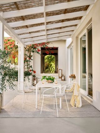 Outdoor dining area with white porch area