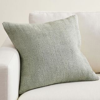 Faye Linen Pillow on a sofa.