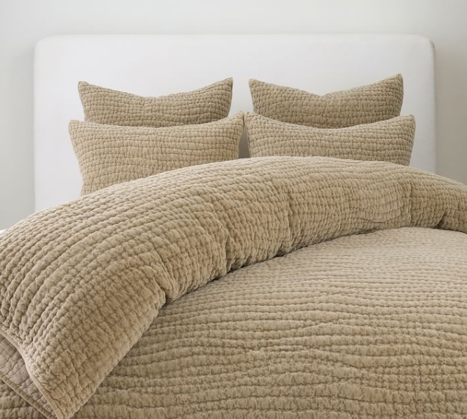 Textured beige quilt.
