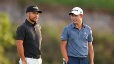 Xander Schauffele and Collin Morikawa talk during the 2024 Sentry