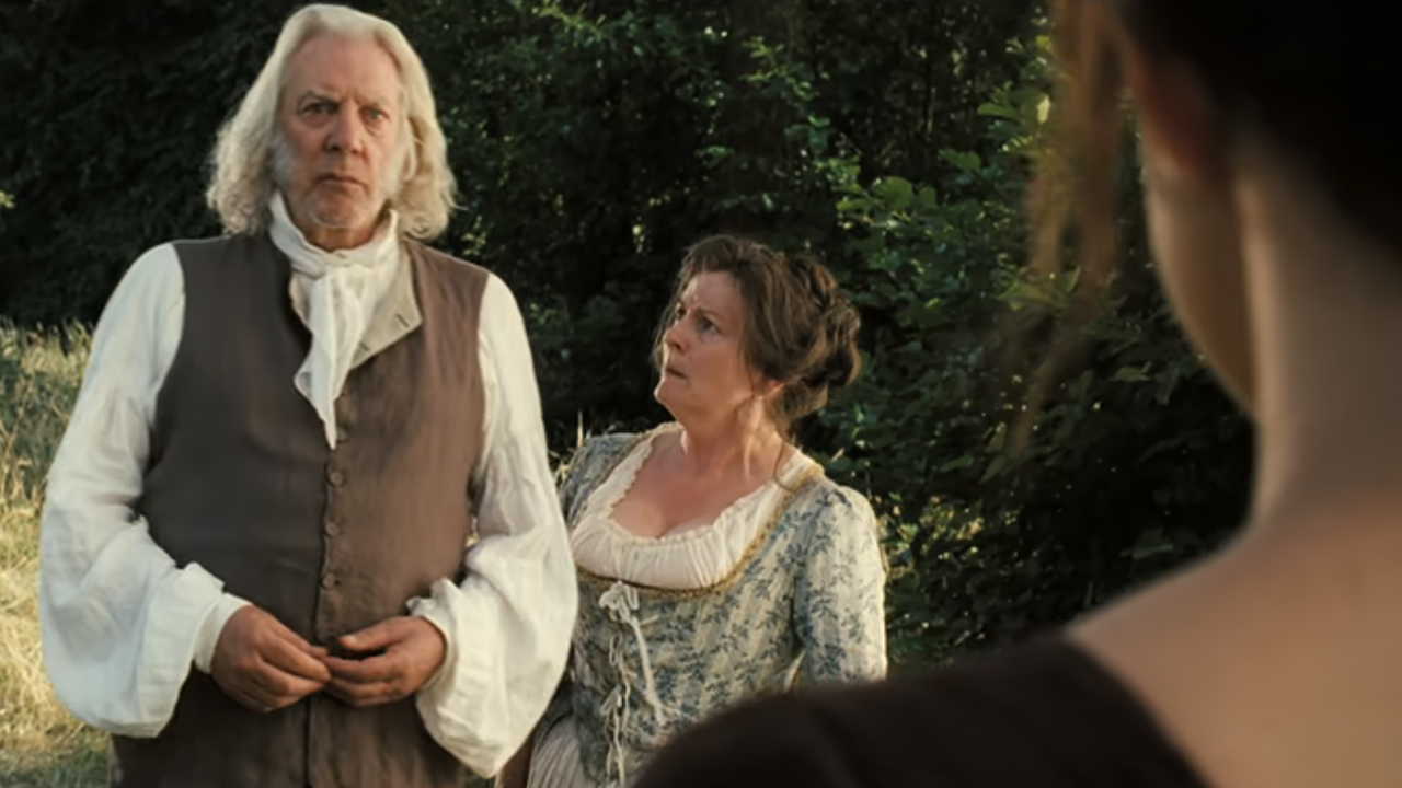Mr. and Mrs. Bennet looking at Elizabeth in Pride & Prejudice 2005