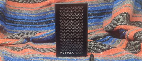 The Victrola ME1 with a picnic blanket as a backdrop.