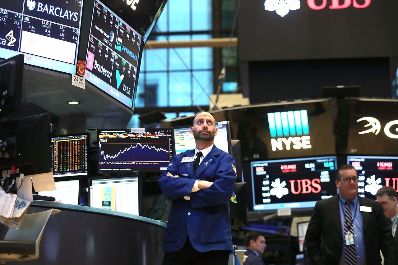 Traders work on the floor of the New York Stock Exchange.