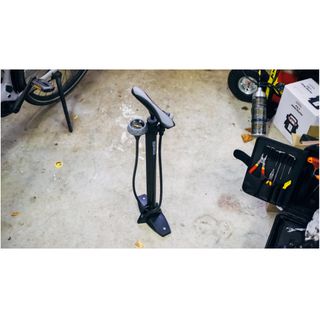 A bicycle pump in a garage 