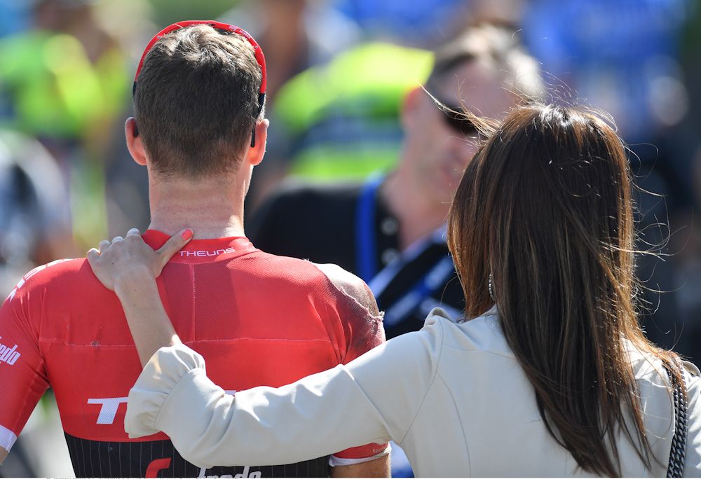 Edward Theuns is comforted by his girlfriend after crashing in the finish of stage 1 at the Belgium Tour.