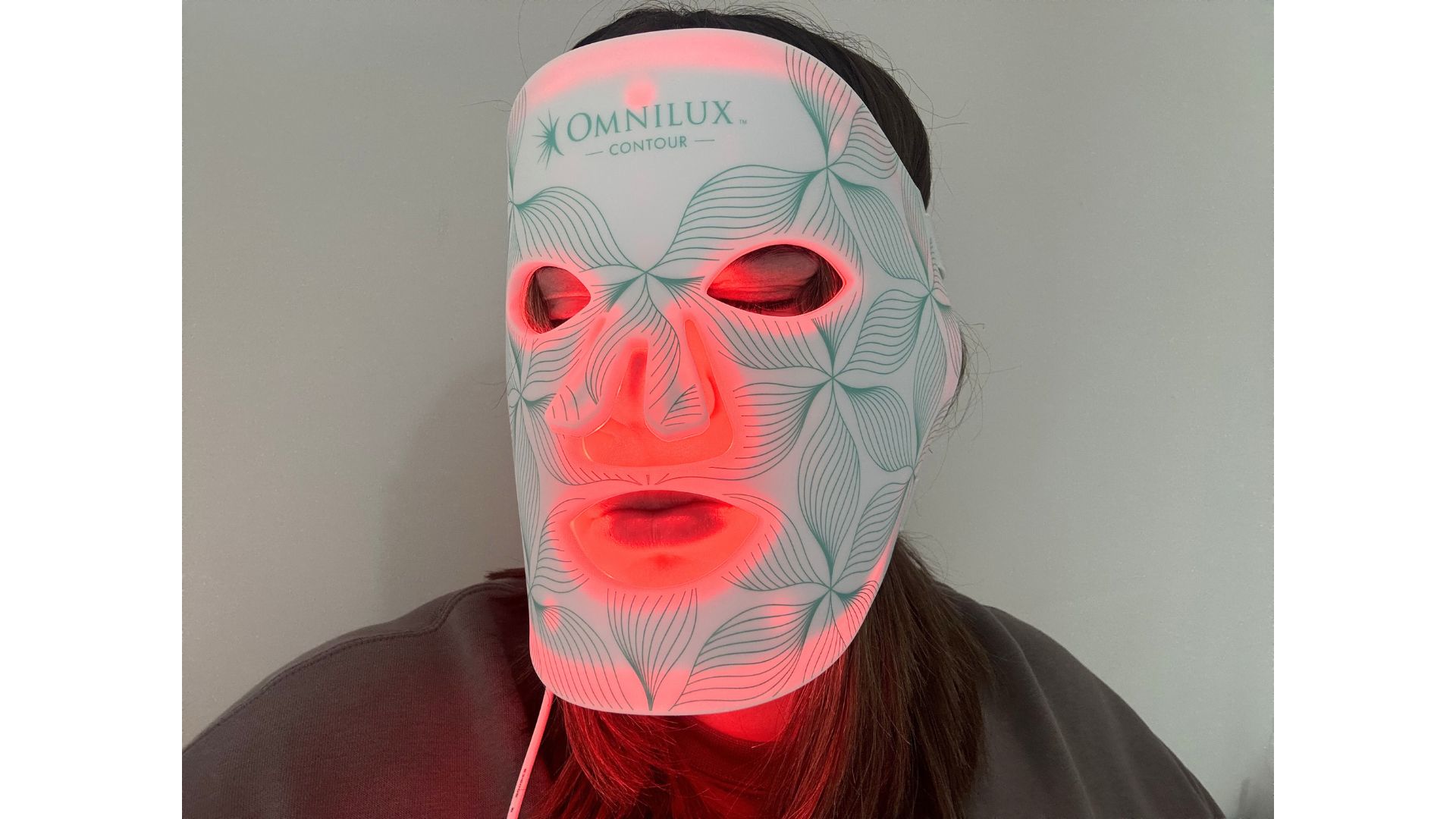 Lucy Partington wearing the Omnilux Contour Face Mask.
