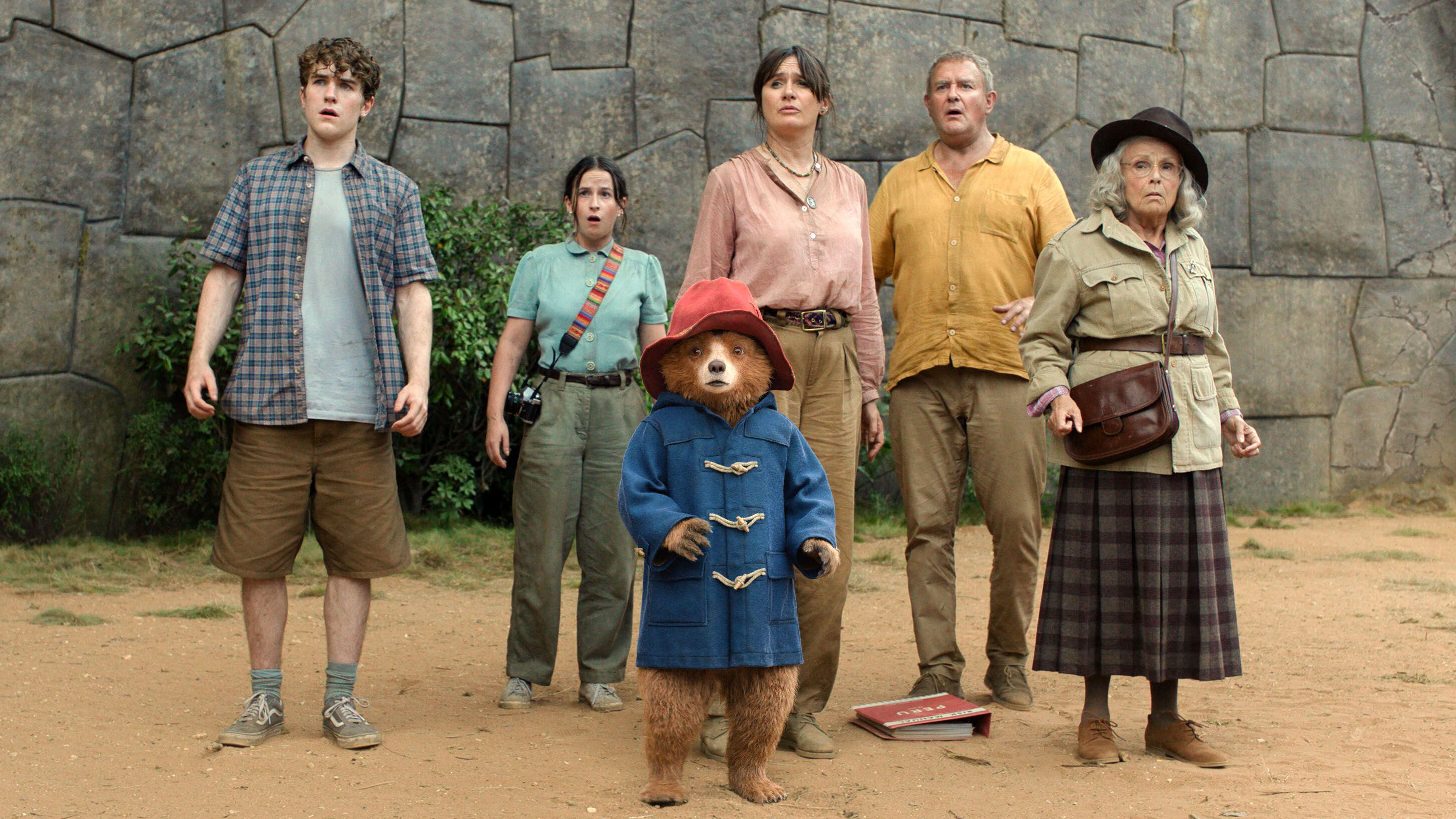 L-R: Samuel Joslin, Madeleine Harris, Paddington Bear, (voiced by Ben Whishaw), Emily Mortimer, Hugh Bonneville, and Julie Walters in a scene from "Paddington in Peru"