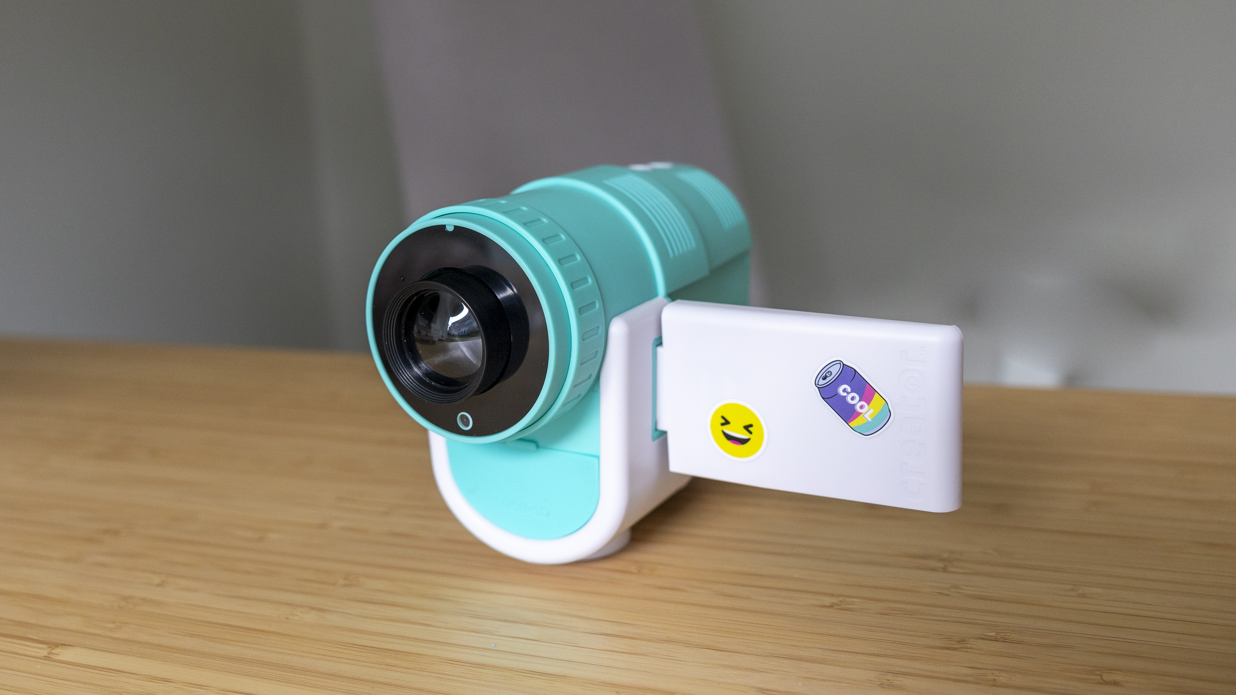 The Photo Creator projector video camera being handled in a home office