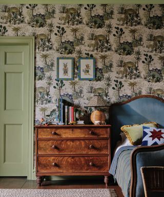 Children's bedroom with green wallpaper and vintage bed