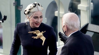  Lady Gaga speaks to President-elect Joe Biden during the 59th Presidential Inauguration 