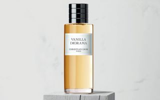 Dior Vanilla Diorama Fragrance on a gray stand