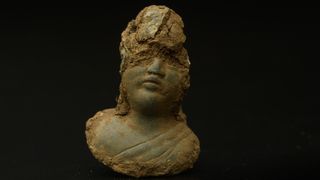 Roman female deity scale weight uncovered during the archaeology excavation at Blackgrounds, Chipping Warden