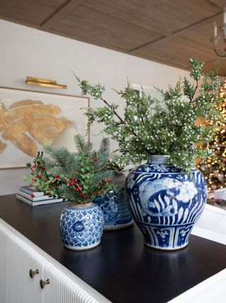 festive foliage in blue and white jars