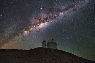 The European Southern Observatory 3.6-meter telescope at La Silla, Chile, posed under a time-lapse picture of the Milky Way. The HARPS-N instrument on this telescope is used to look for exoplanets.