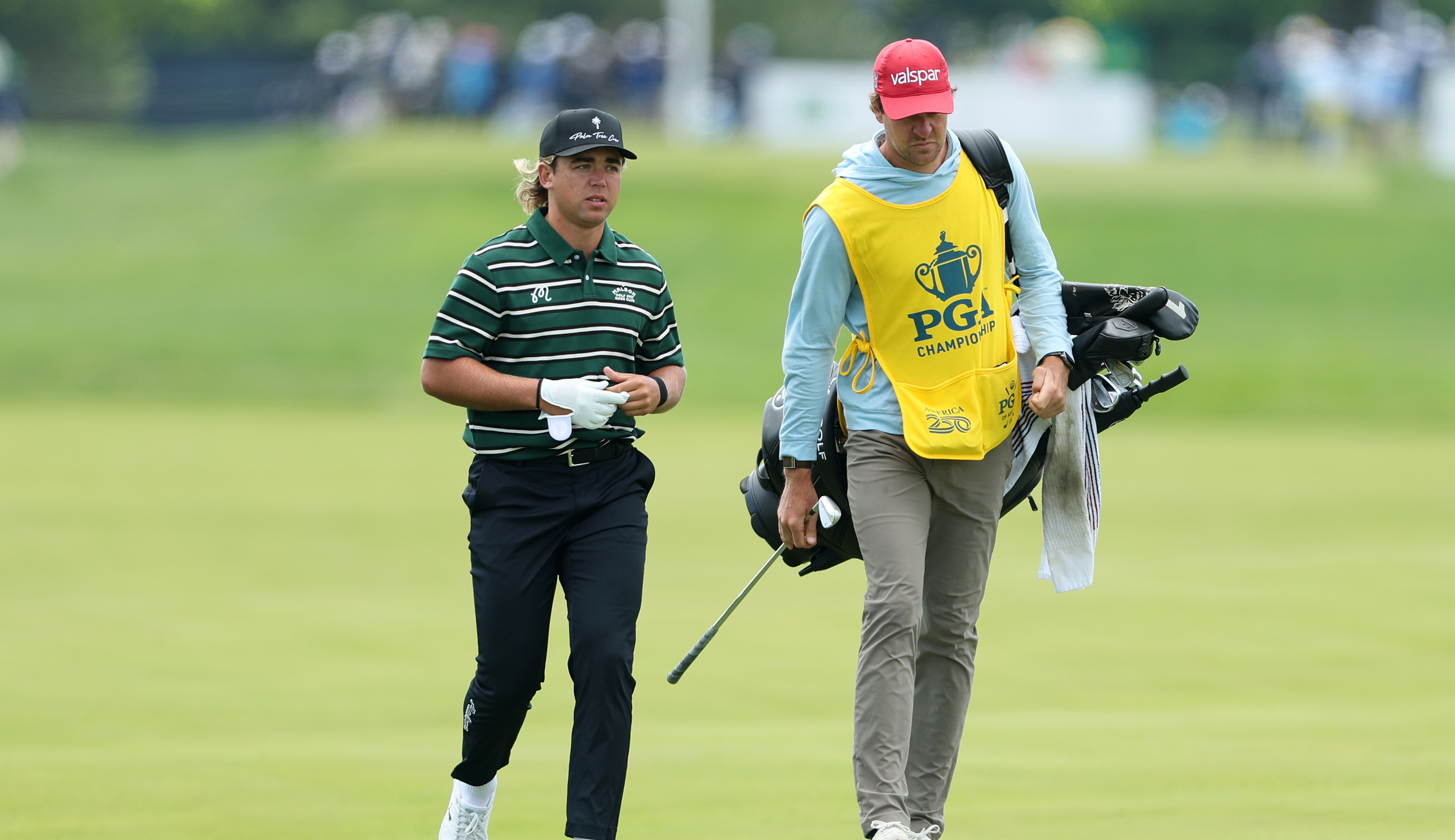 Garrick Higgo walks with his caddie during the PGA Championship