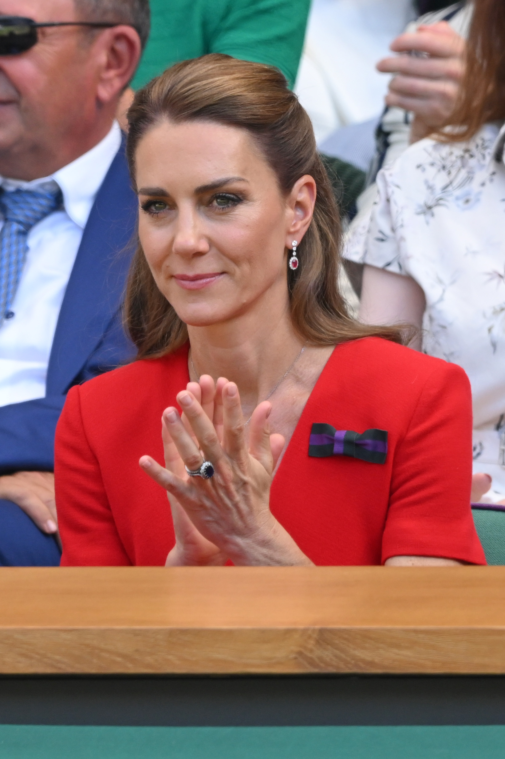 Kate Middleton wears a bright red Roland Mouret dress and carries a taupe bag at Wimbledon on July 11, 2026
