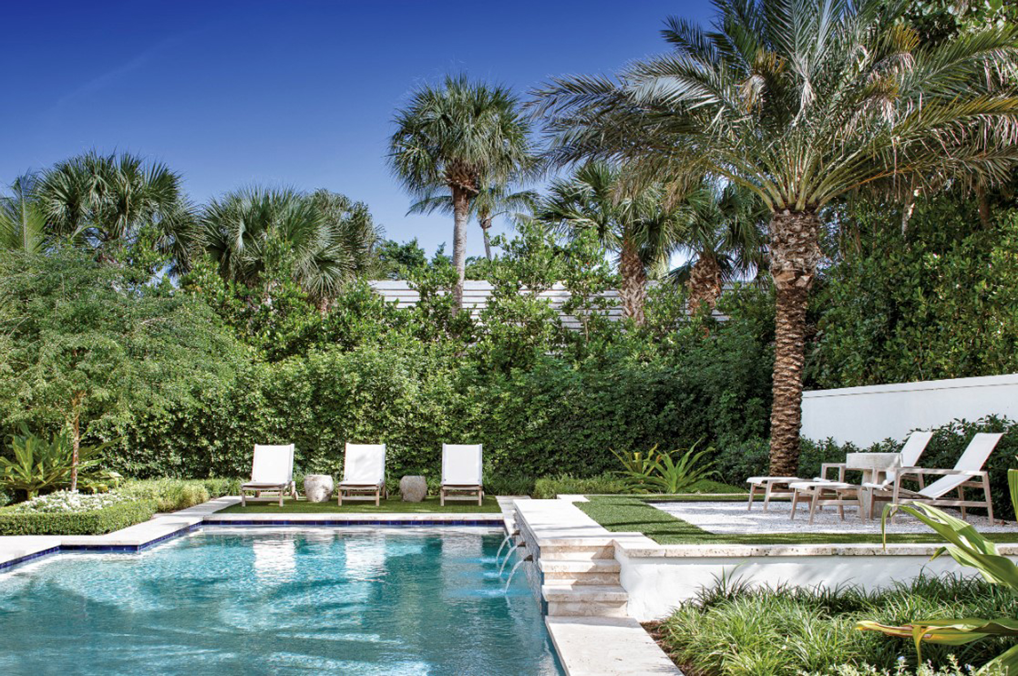 pool landscaping ideas: modern pool with raised terraces for sun loungers