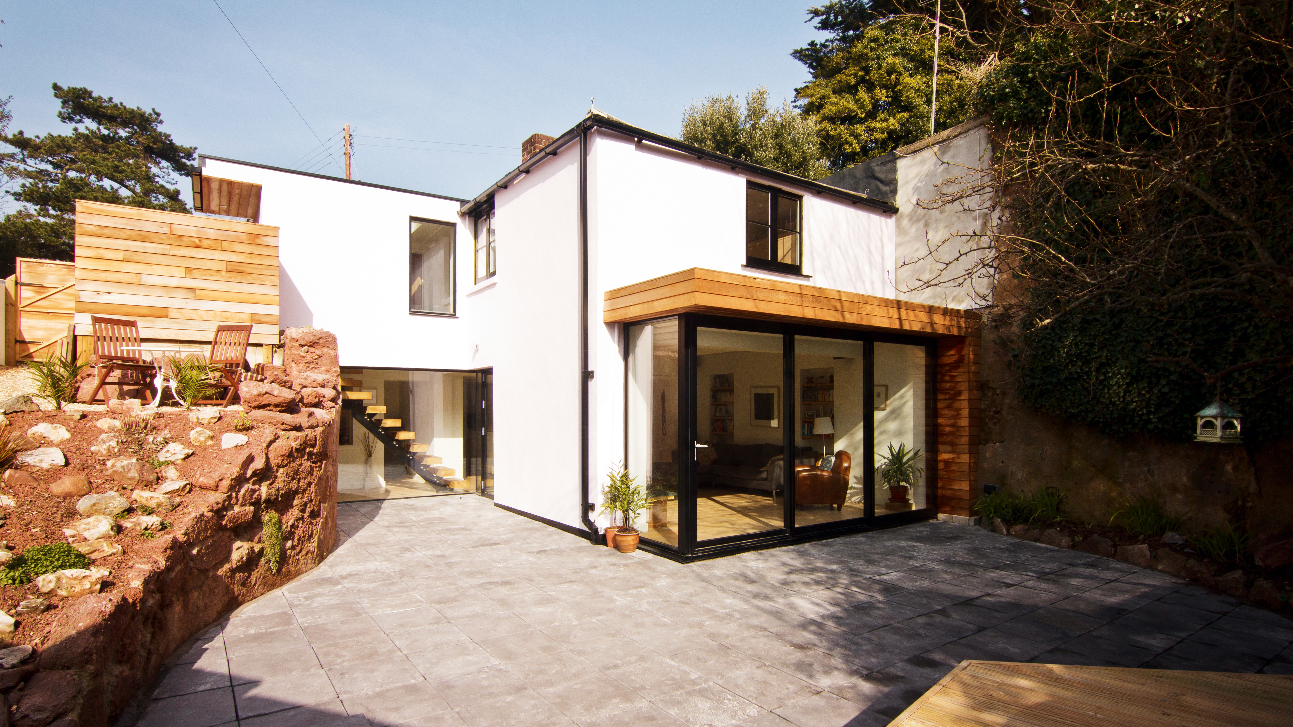 lower level garage converted in to a kitchen diner and living space by Barc Architects