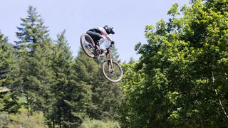 A rider doing a big air on a mountain bike