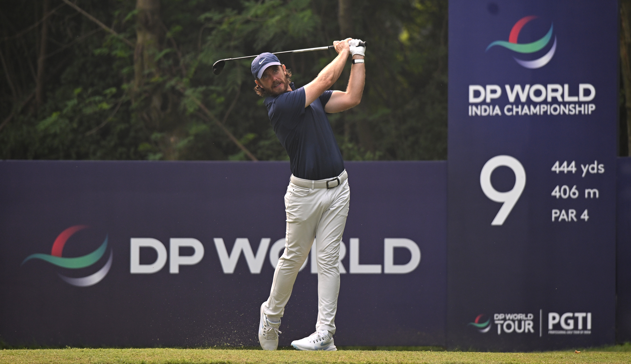 Tommy Fleetwood hits a fairway wood
