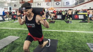 A man performing ram lunges doing a DEKA