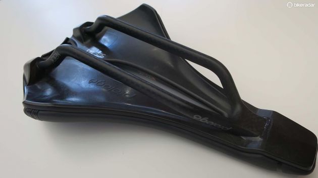 The hull is shaped to offer flex at the wings and at the edges of the pressure relief channel