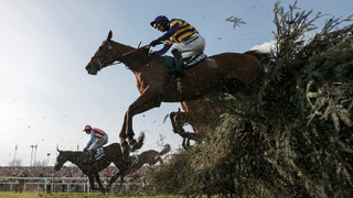 Corach Rambler with Derek Fox on board jump The Chair on their way to to winning the Grand National during racing on day three of the Grand National jump racing festival at Aintree Racecourse on April 15th 2023 in Liverpool, England