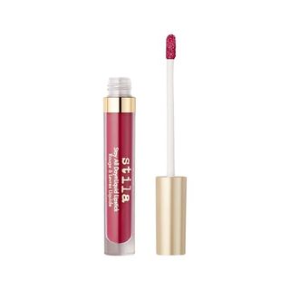 Stila Stay All Day Liquid Lipstick open beside its applicator on a white background