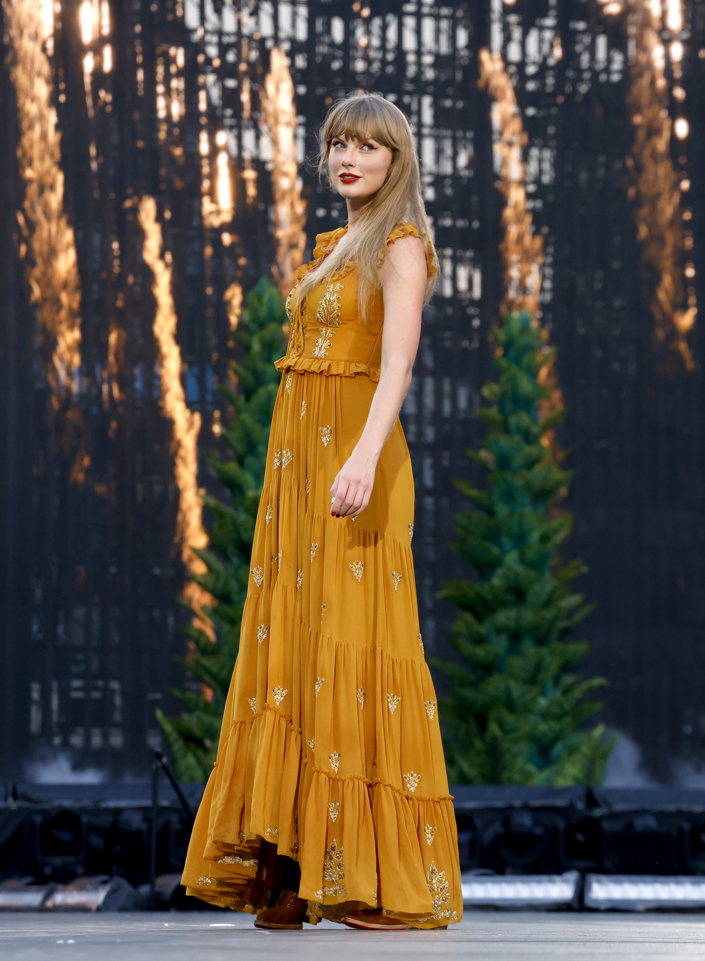 Taylor Swift wearing a tiered Etro dress on the Eras Tour