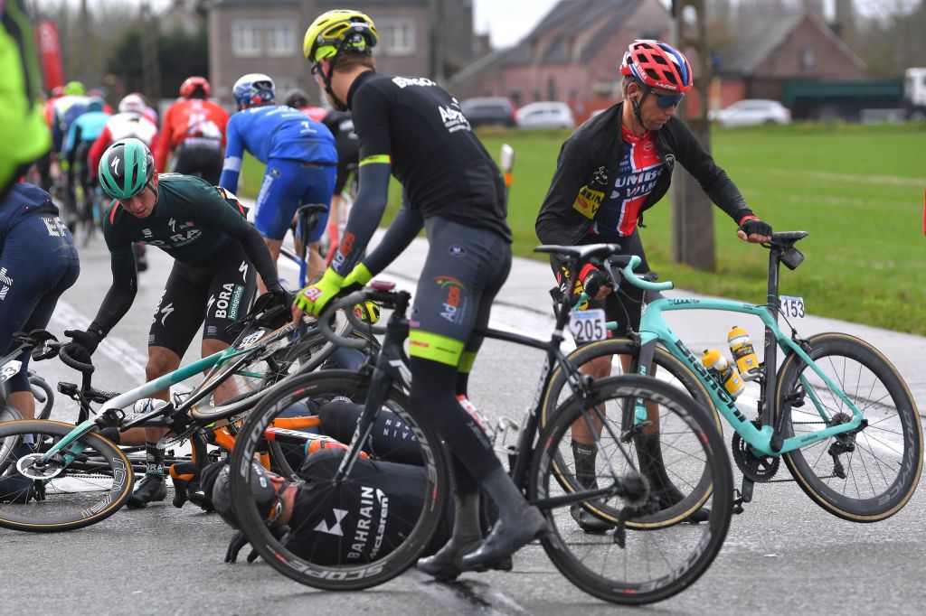 NINOVE BELGIUM FEBRUARY 29 Amund Grndahl Jansen of Norway and Team Jumbo Visma Franklin Six of Belgium and Team Wallonie Bruxelles Ide Schelling of The Netherlands and Team Bora Hansgrohe Crash Peloton during the 75th Omloop Het Nieuwsblad 2020 Men Race a 200km race from Ghent to Ninove OmloopHNB OHN20 on February 29 2020 in Ninove Belgium Photo by Tim de WaeleGetty Images