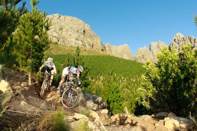 Nino Schurter (right) and Florian Vogel of the SCOTT Swisspower team tussle for a line through a tight turn during a training ride in Stellenbosch, South Africa. The Swiss pair will be aiming for a high overall finish in the 2013 Absa Cape Epic next month.