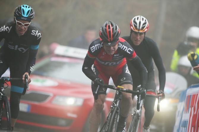 Cadel Evans rides through the rain on the Jafferau