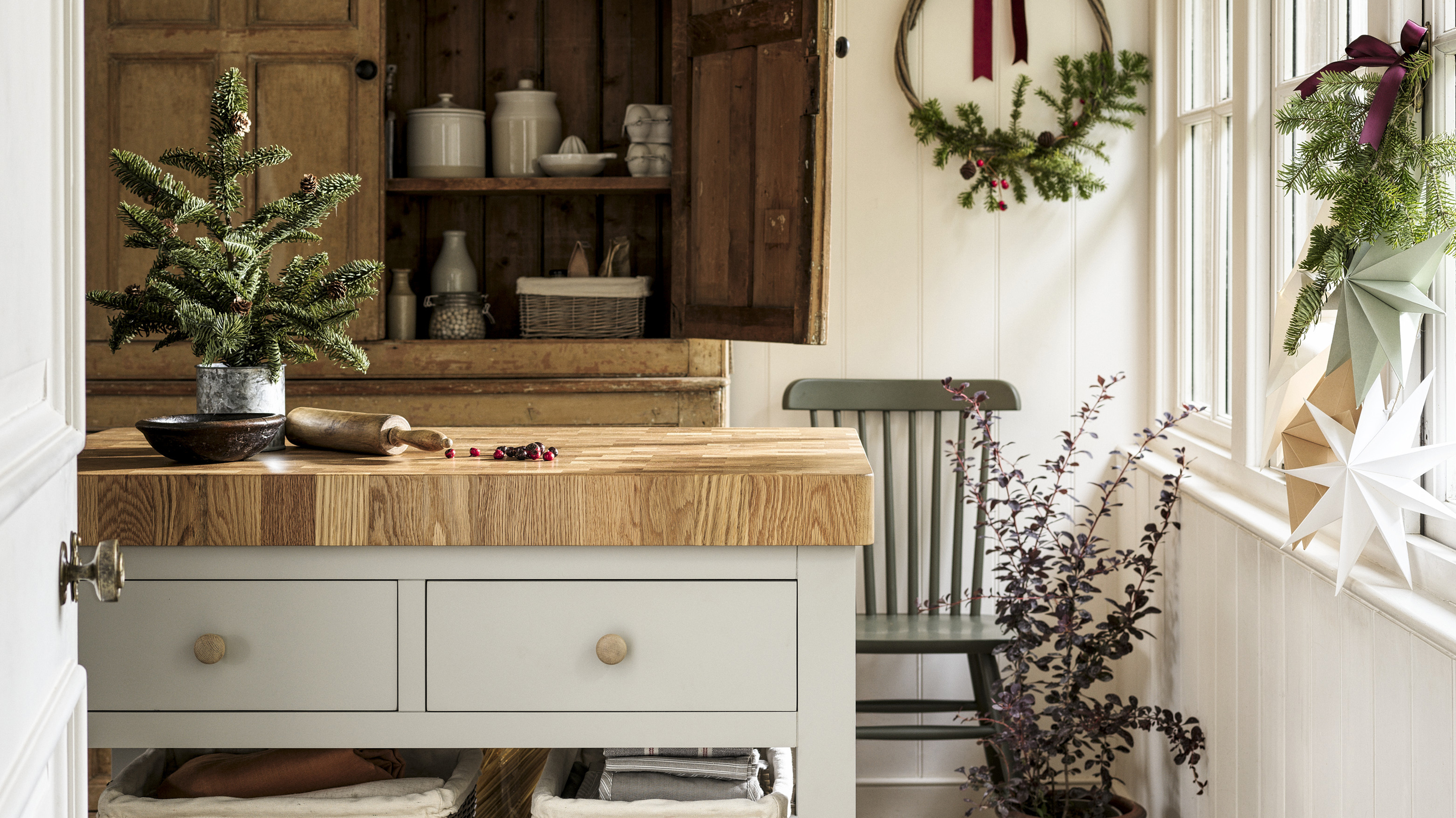Kitchen with island and small christmas tree