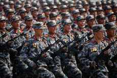 North Korean soldiers march during a military parade.