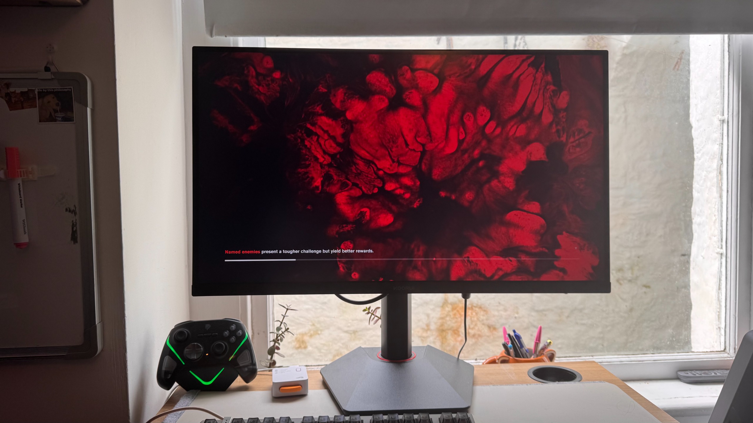 Koorui G2741L gaming monitor, playing Control, on a desk