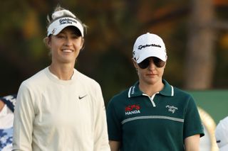 Nelly Korda and Charley Hull walk down the fairway