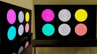 Samsung QN95C TV displaying multicolored test patterns seen from front and side