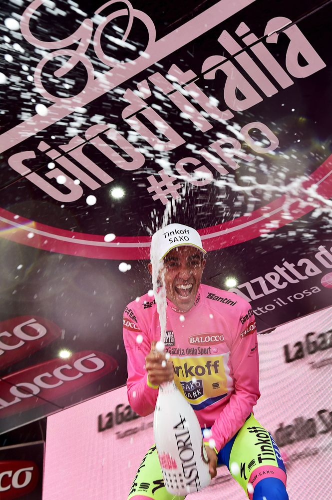Alberto Contador lets go on the final podium of the 2015 Giro d'Italia.