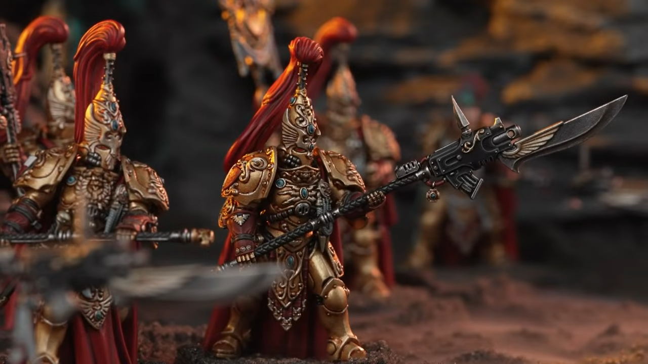 Warhammer Custodes miniatures on a blasted battleground