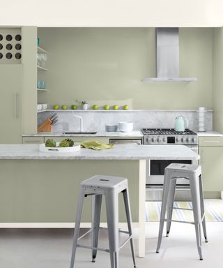 pale green sage kitchen with marble worktops