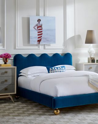 Wavy, blue bed frame in a white bedroom