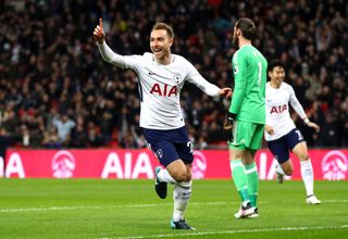 Christian Eriksen of Tottenham Hotspur celebrates after scoring his sides first goal during the Premier League match between Tottenham Hotspur and Manchester United at Wembley Stadium on January 31, 2018 in London, England.