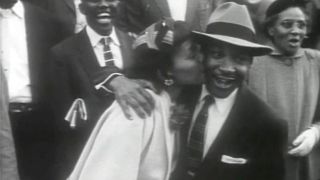 Coretta Scott King kisses Martin Luther King Jr. in Martin Luther King Jr.: A Historical Perspective.