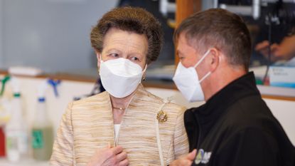 Princess Anne's cream handbag during visit to the National Crisis Management Centre in the basement bunker 