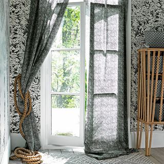 window curtain with chunky rope and fern wallpaper