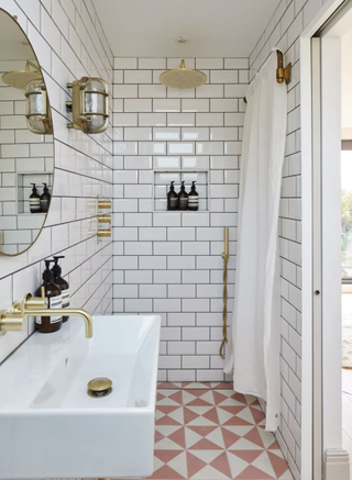 Ensuite bathroom with pink floor tiles