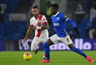 Yves Bissouma, right, will miss the game at the Etihad through suspension