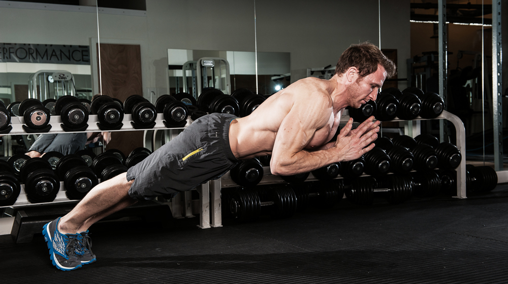 Man does clap press-up chest exercise