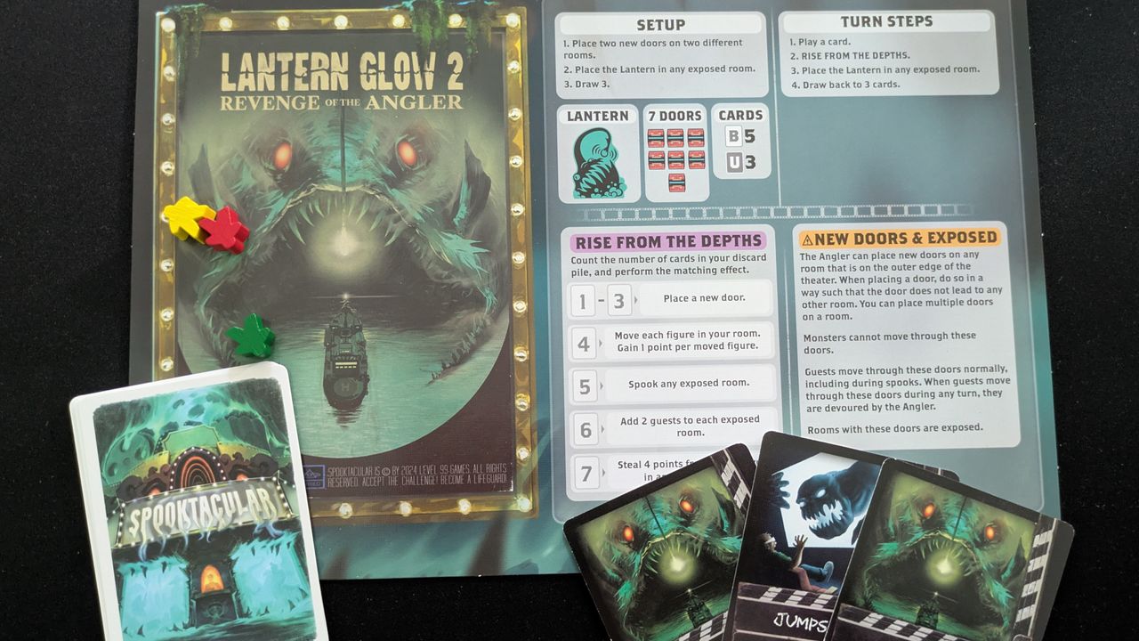 Monster board and cards from Spooktacular on a black background