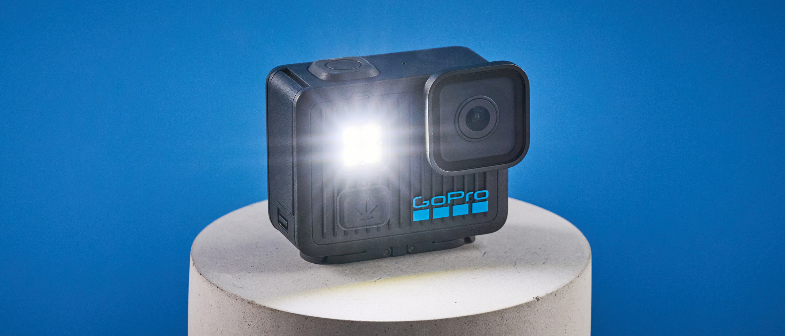 The GoPro LIT Hero against a blue background